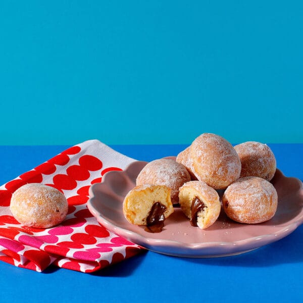 A plate containing a selection of our mini Choco Hazelnut beignets.